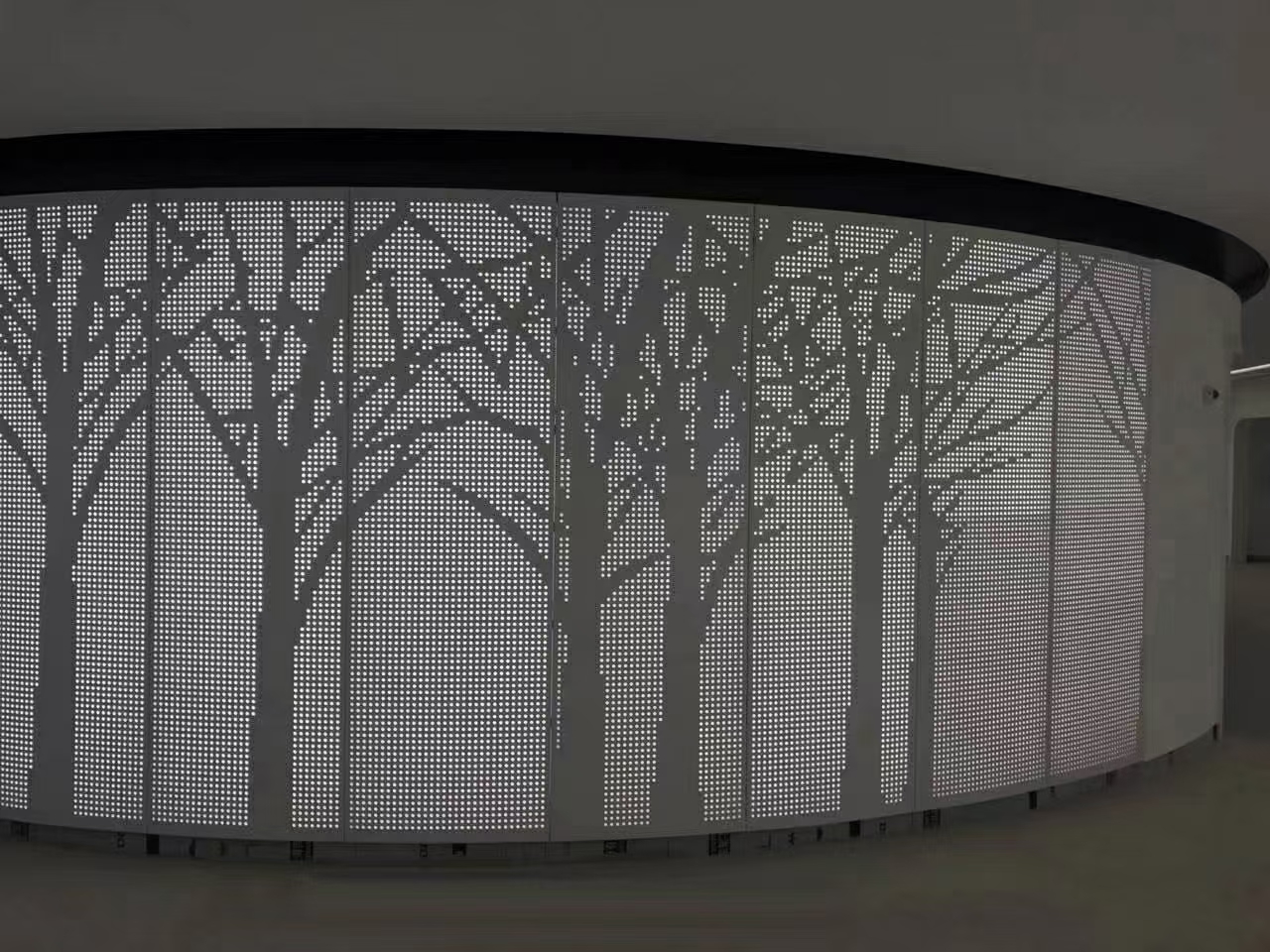 Curved perforated screen, wood-transfer finish